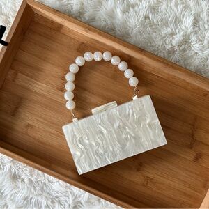 Chic Pearl-Handled White Clutch